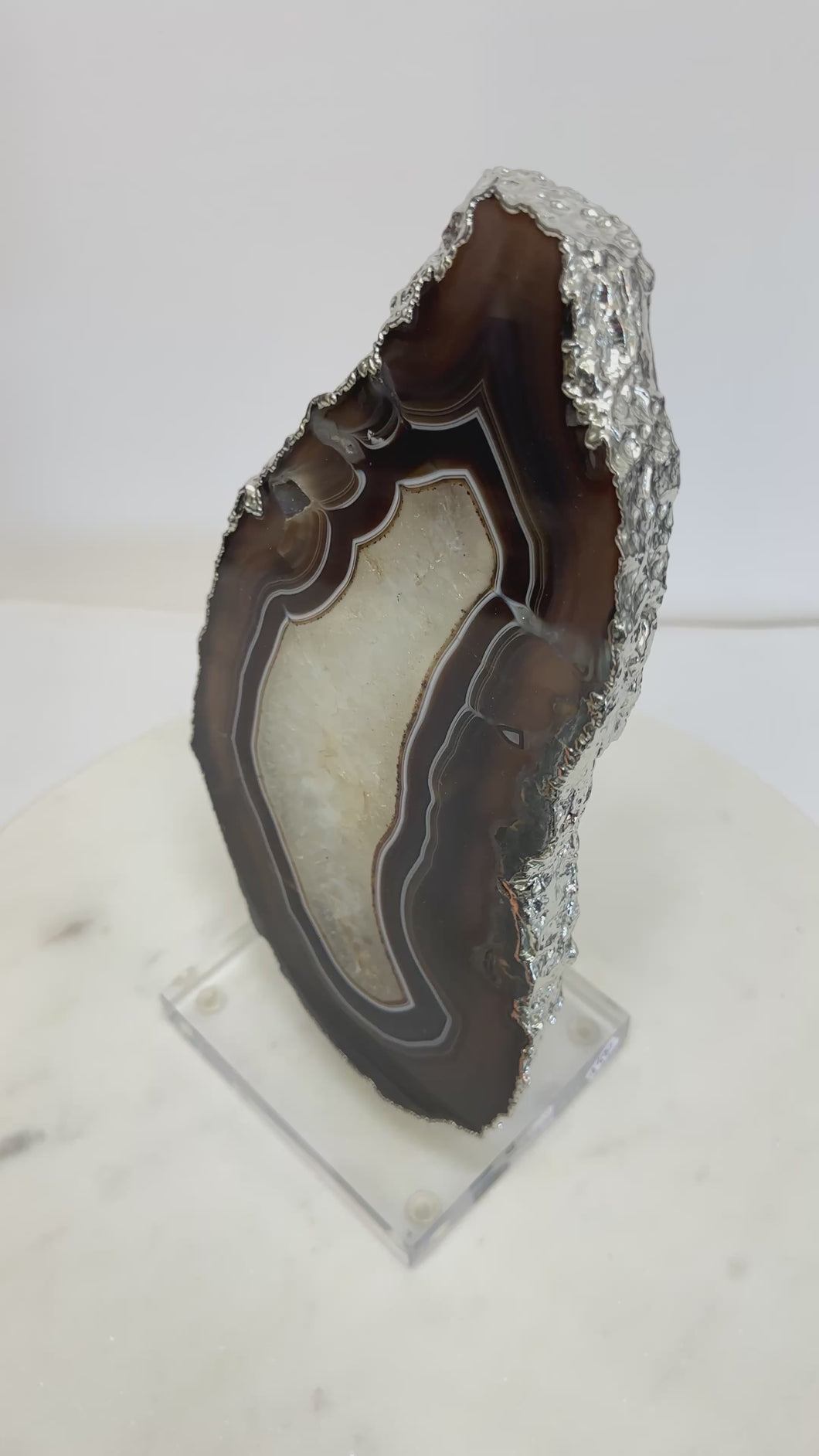 Polished Agate Slice with Silver Electroplated Edge on Lucite Base