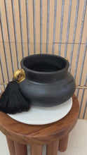 Load and play video in Gallery viewer, Black Brazilian Clay Vase with Gold Leaf and Silk Tassels
